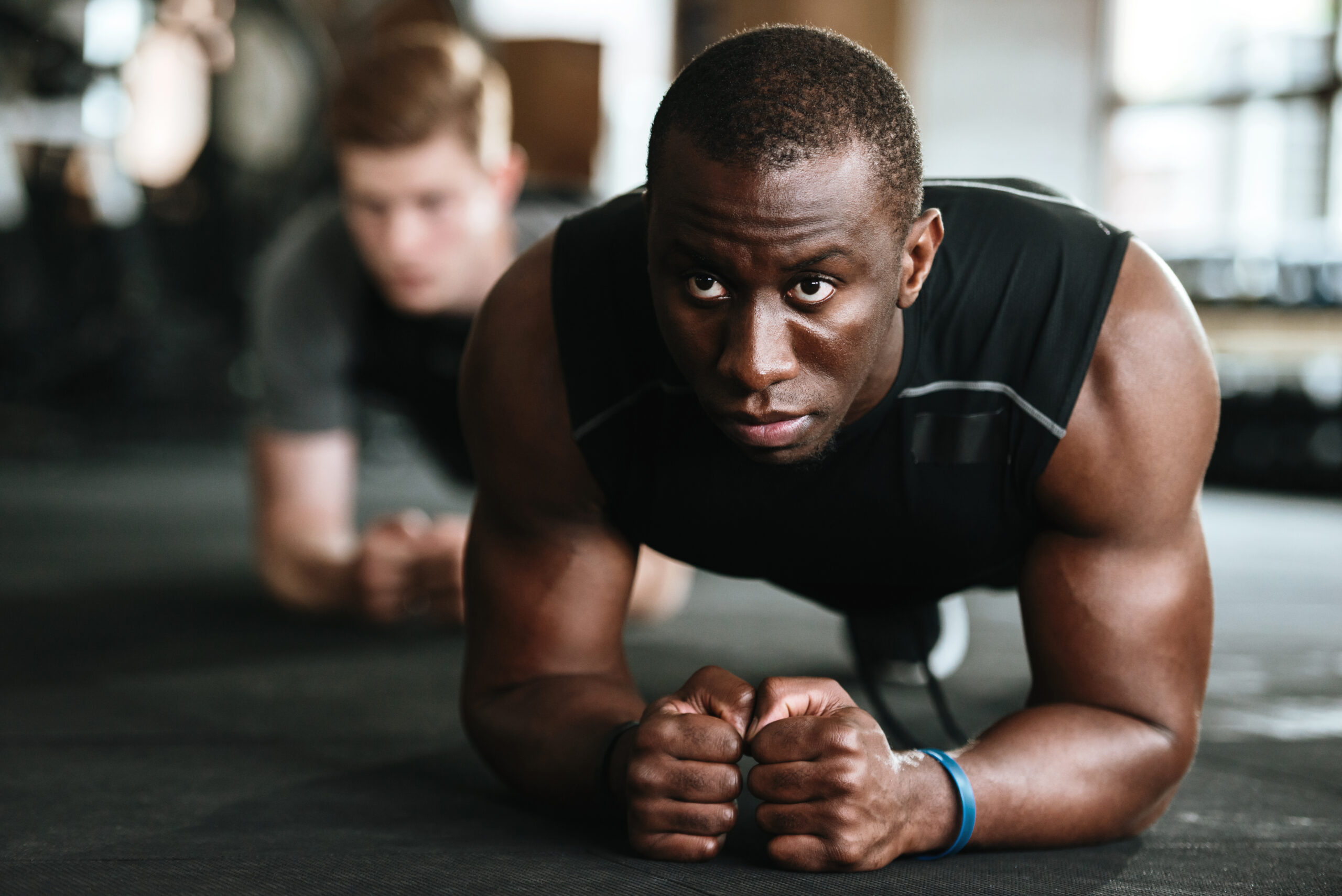storyblocks picture of group of multiethnic sports strong people make sport exercises in gym S0gyt62a5b scaled
